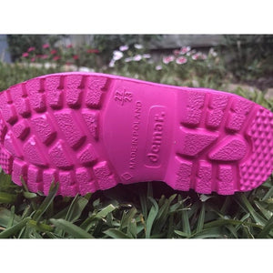 The sole of a pair of Kids Dino Welly Boots in Pink. Comfortable, lightweight and durable. Available to buy from Bright Light Boots